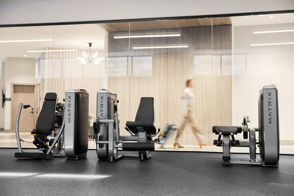 Matrix Fitness — MX LIFESTYLE HOSP DC female walking-past fitness center face-on